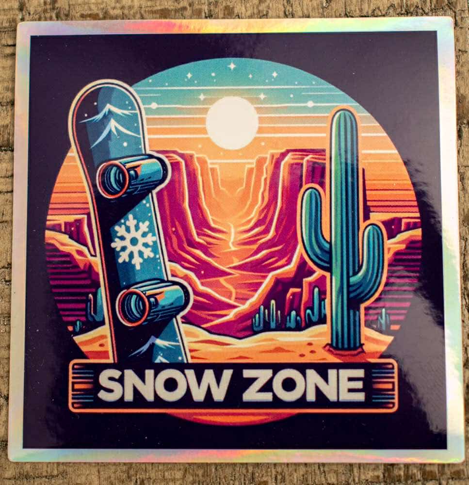 Water and UV proof sticker featuring snowboard and desert sunset design with "Snow Zone" text