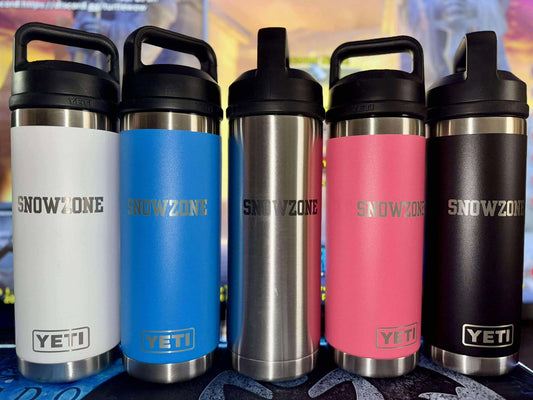 Row of five Yeti Bottles in white, blue, silver, pink, and black with chug caps and Snow Zone logo