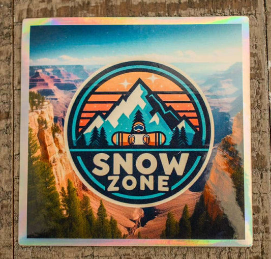 Holographic sticker featuring a mountain landscape with snowboarder and text "Snow Zone"