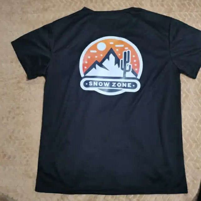 Black dry fit short sleeve shirt with snow zone mountain and cactus graphic on back